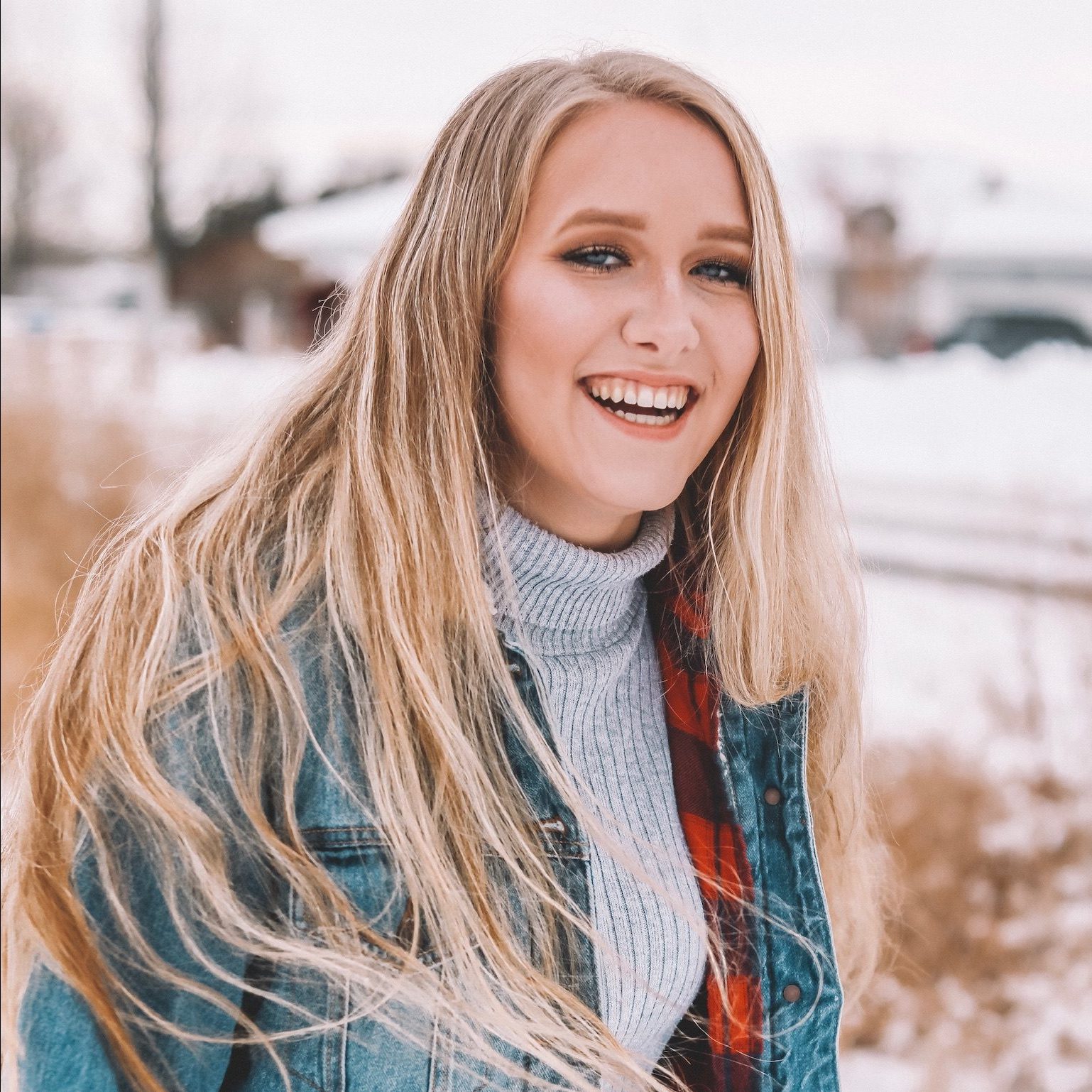 Young woman smiling outdoors in the winter